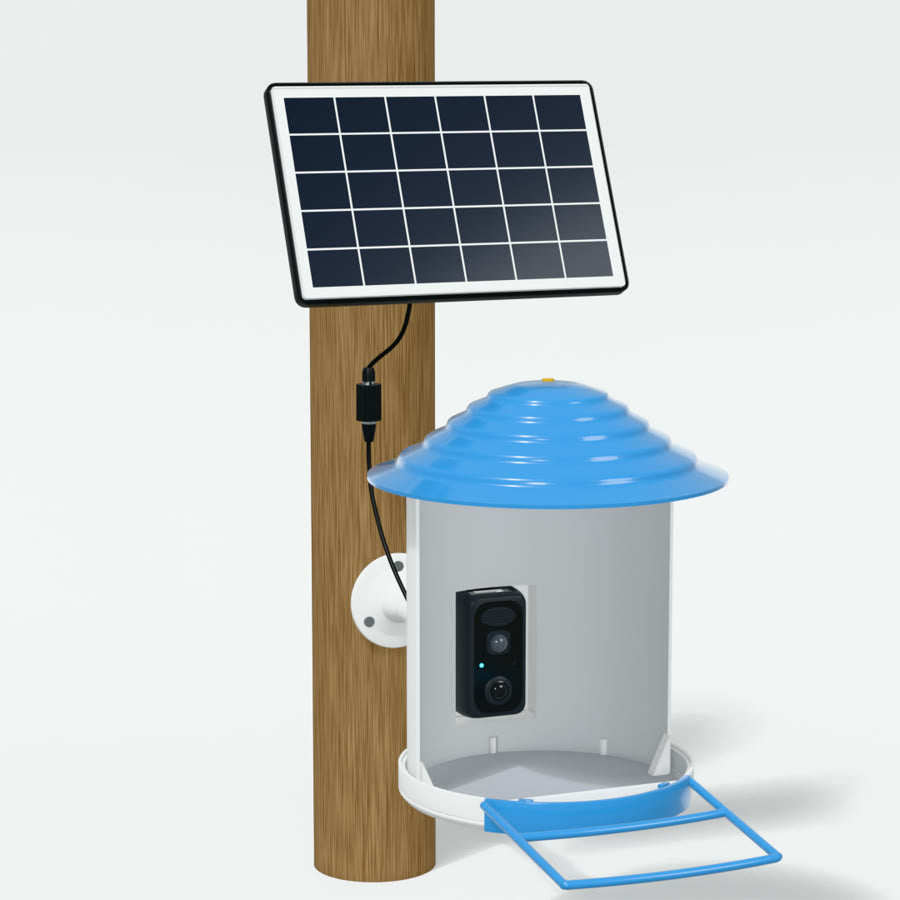 Finished install on a wooden post: solar panel on the black stand above, feeder on the white arm below, cables joined