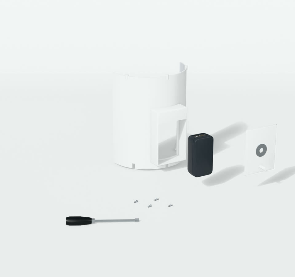 Camera lifted out of the middle wall with its back cover and screws beside it